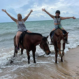 Horseback riding in ocean